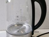 a close up of a glass tea kettle on a counter