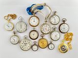 many different types of pocket watches on the table
