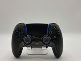 a close up of a video game controller on a white surface