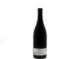 a bottle of wine that is sitting on a table