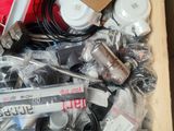 a wooden box filled with assorted electronics and other items