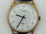 a watch that is sitting on a white surface