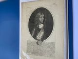 a picture of a portrait of a man hanging on a wall
