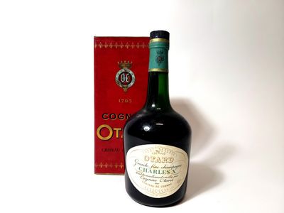 a bottle of wine sitting next to a box of wine