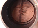 a close up of a vase with a label on it