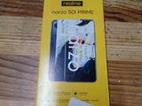 the box of the phone is sitting on a wooden table