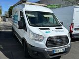 a white van that is parked on the side of the road