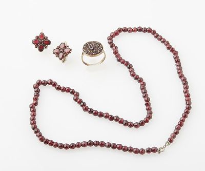 an image of a necklace, ring, and bracelet with garnetts