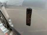 a sticker on the side of a car with a ruler on it