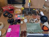 a table with many items on it that include scissors, scissors and other items