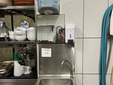 a kitchen with a sink and a dishwasher in it