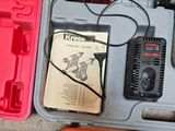 a tool kit in a plastic case on the ground