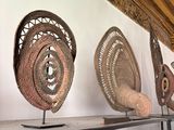 many decorative items on a shelf in a room