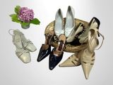 several pairs of women ' s shoes and a basket of flowers