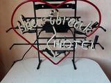 a heart shaped sign that says hello to all of us