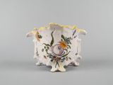 an image of a vase with flowers painted on it
