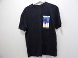 a black t - shirt with a picture of a palm tree on it