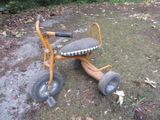a small tricycle that is sitting on the ground