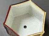 a small box with a hole in it on a table