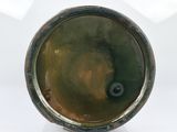 an image of a close up of a metal object on a white surface