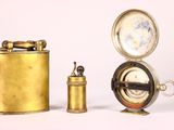 three different types of brass items on a white surface