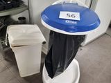 a trash can sitting next to a trash can in a bathroom