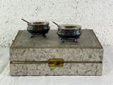 two bowls of soup sitting on top of a box