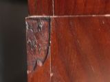 a close up of a piece of wood with peeling paint on it