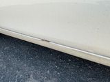 a white car parked on the side of the road