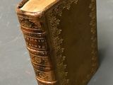 an old book that is sitting on a table