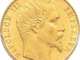 gros plan d'une pièce d'or portant un visage de femme