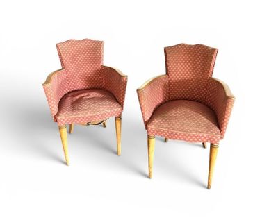 pair of pink upholstered chairs with wooden legs and arms