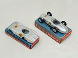 two toy cars that are sitting on top of a box