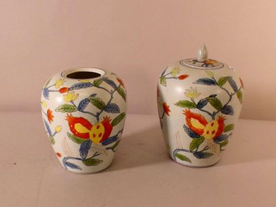 two vases that are sitting on a table