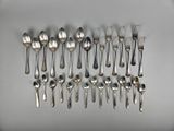 a lot of spoons and spoon spoons on the table