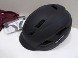 a helmet that is sitting on a table next to a bag