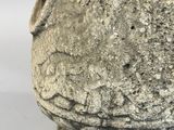 a stone statue of a head on a white background