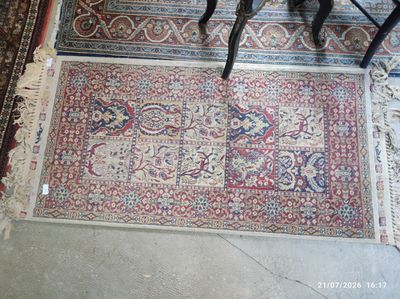 a rug on the floor in a room with two chairs