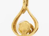 an image of a gold pendant with an elephant inside of it