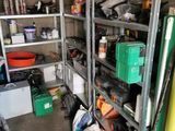 a garage with a lot of tools on the shelves