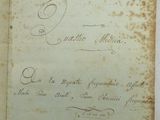 an old book with writing on it sitting on a table