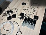 a table that has a bunch of wires on it
