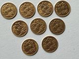 a close up of a bunch of coins sitting on top of a table
