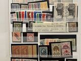 a display of stamps on display in a glass case