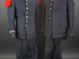 two men ' s military uniforms, one in blue and the other in red