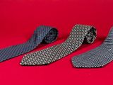 three ties on a red background with a red background
