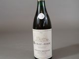 a bottle of wine that is sitting on a table