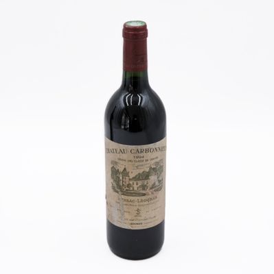 a bottle of wine that is sitting on a table