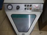a white oven sitting on the floor in a room