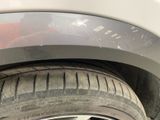 a close up of a tire on a car ' s rim